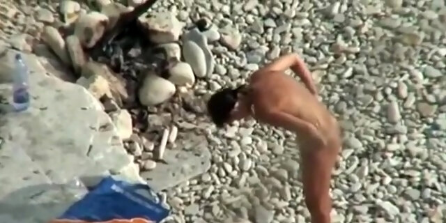 Voyeur Tapes A Girl Playing With Her Bf's Cock On A Nudist Beach